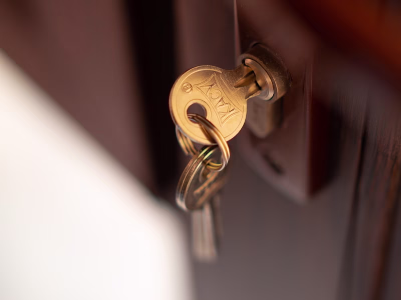 a close up of a key on a door